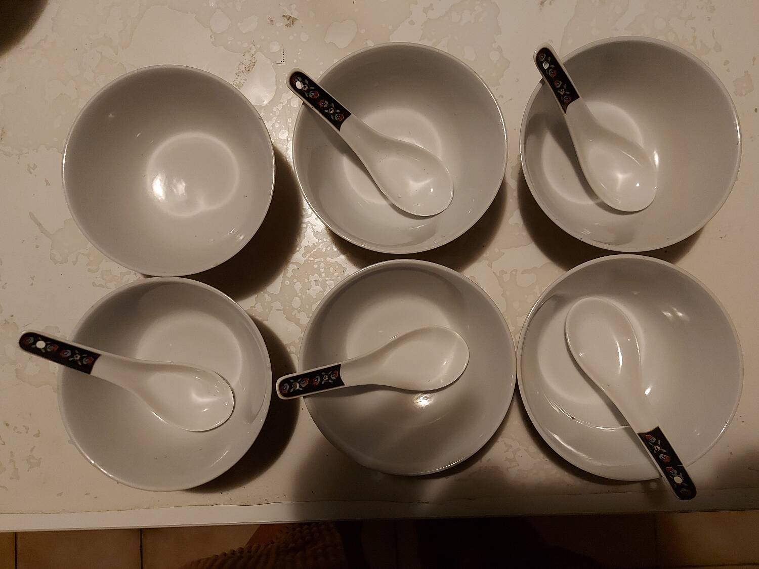 Set of oriental bowls and spoons