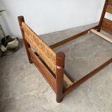 Brutalist style bed with chain and straw