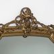 Miroir en bois doré de style néo-classique à motif corde et pompons