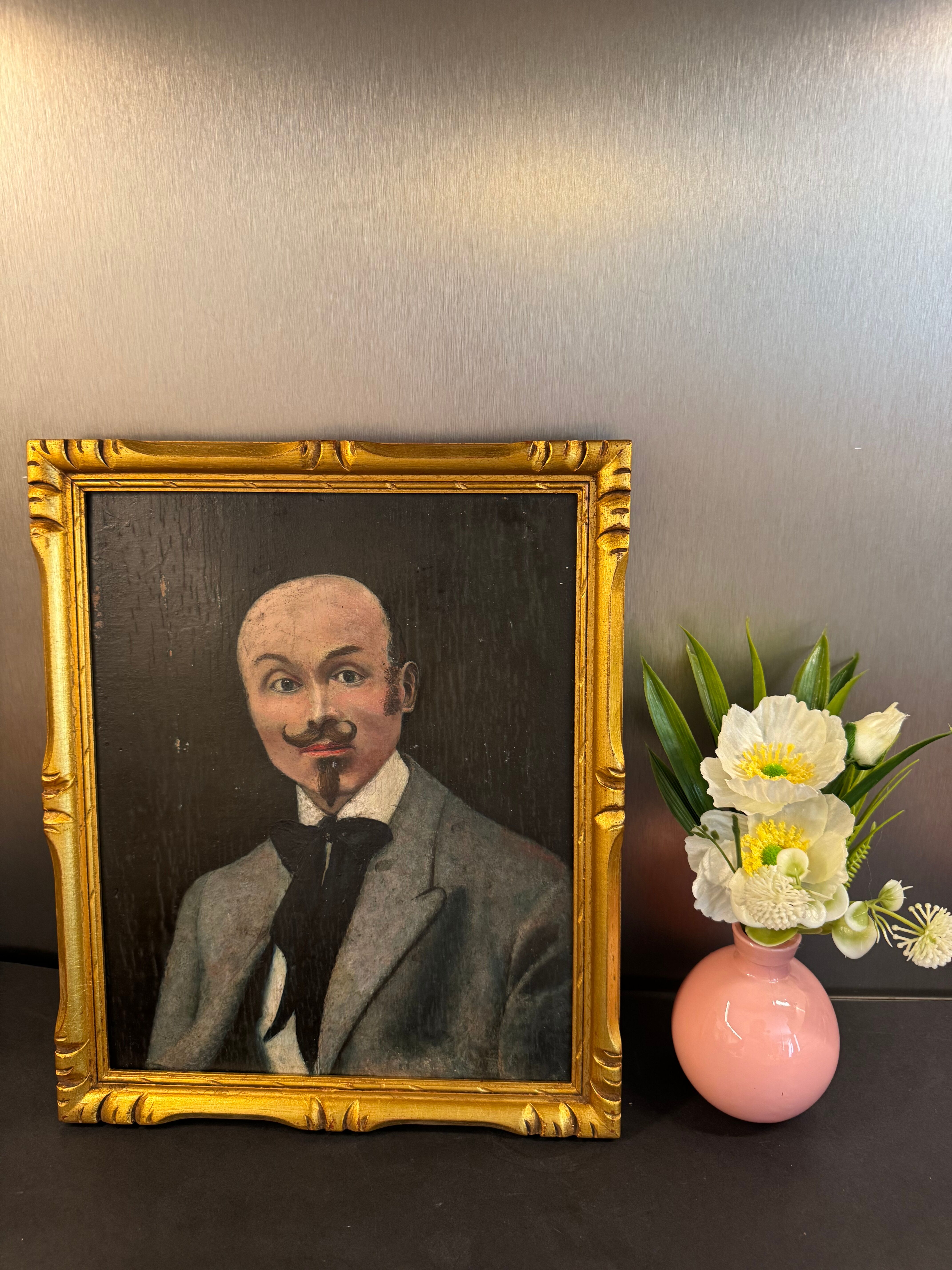 Portrait of a dandy with a moustache from the early 20th century.
