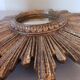 Miroir soleil vintage , en bois doré .