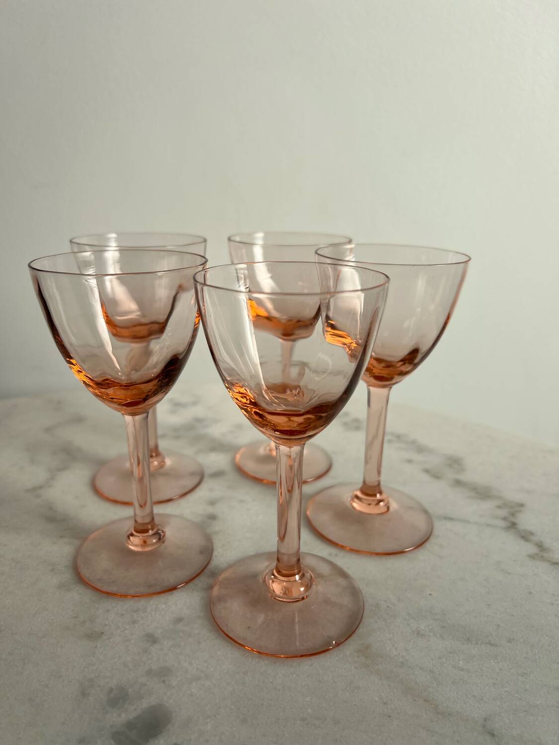 5 small pink glass stemmed glasses