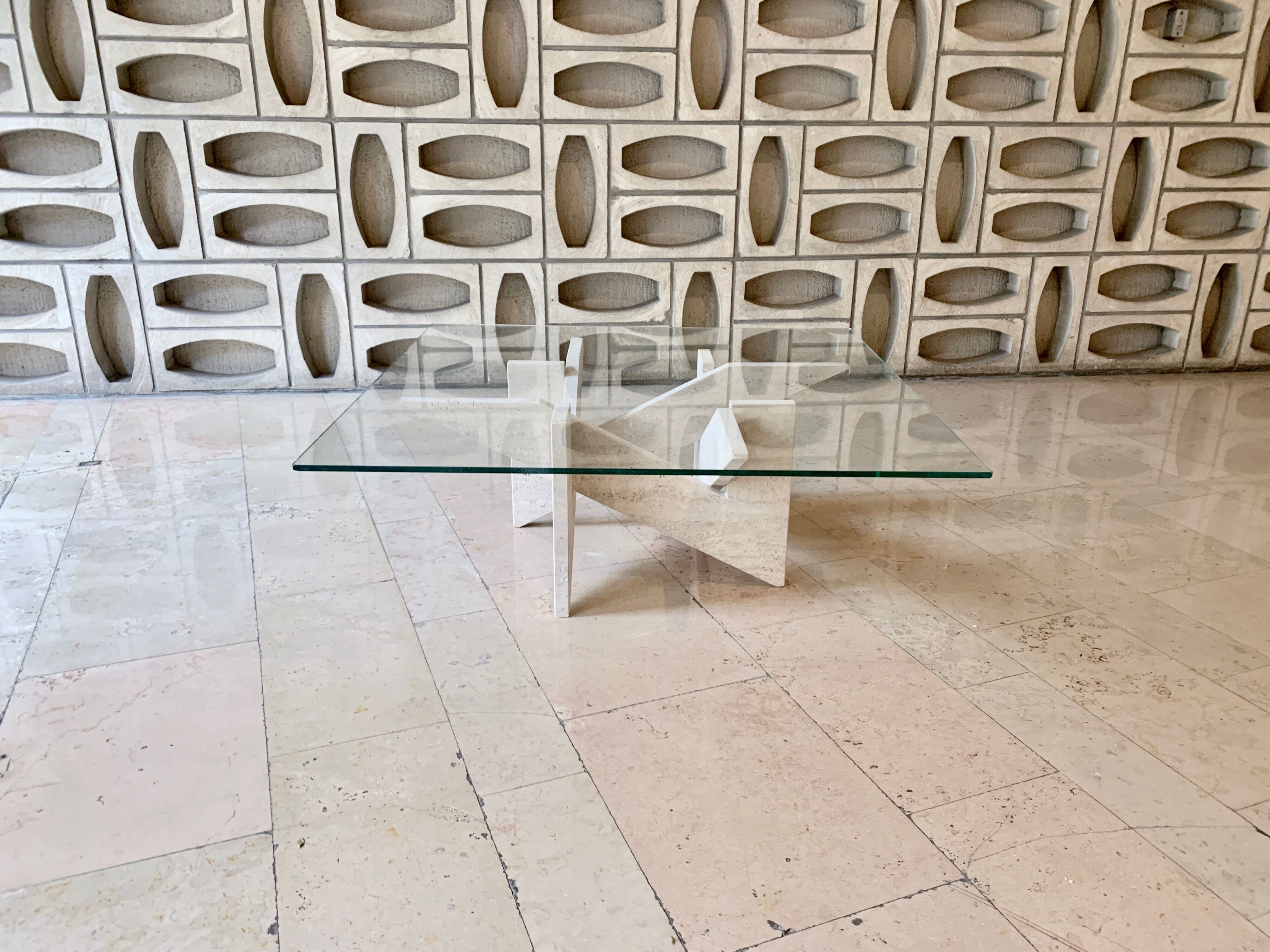 Travertine sculptural coffee table with square top