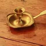 Old brass hand candle holder