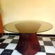 Dining table with rattan marquetry