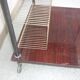 Wooden vintage table on wheels
