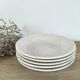 Beige speckled hollow plates