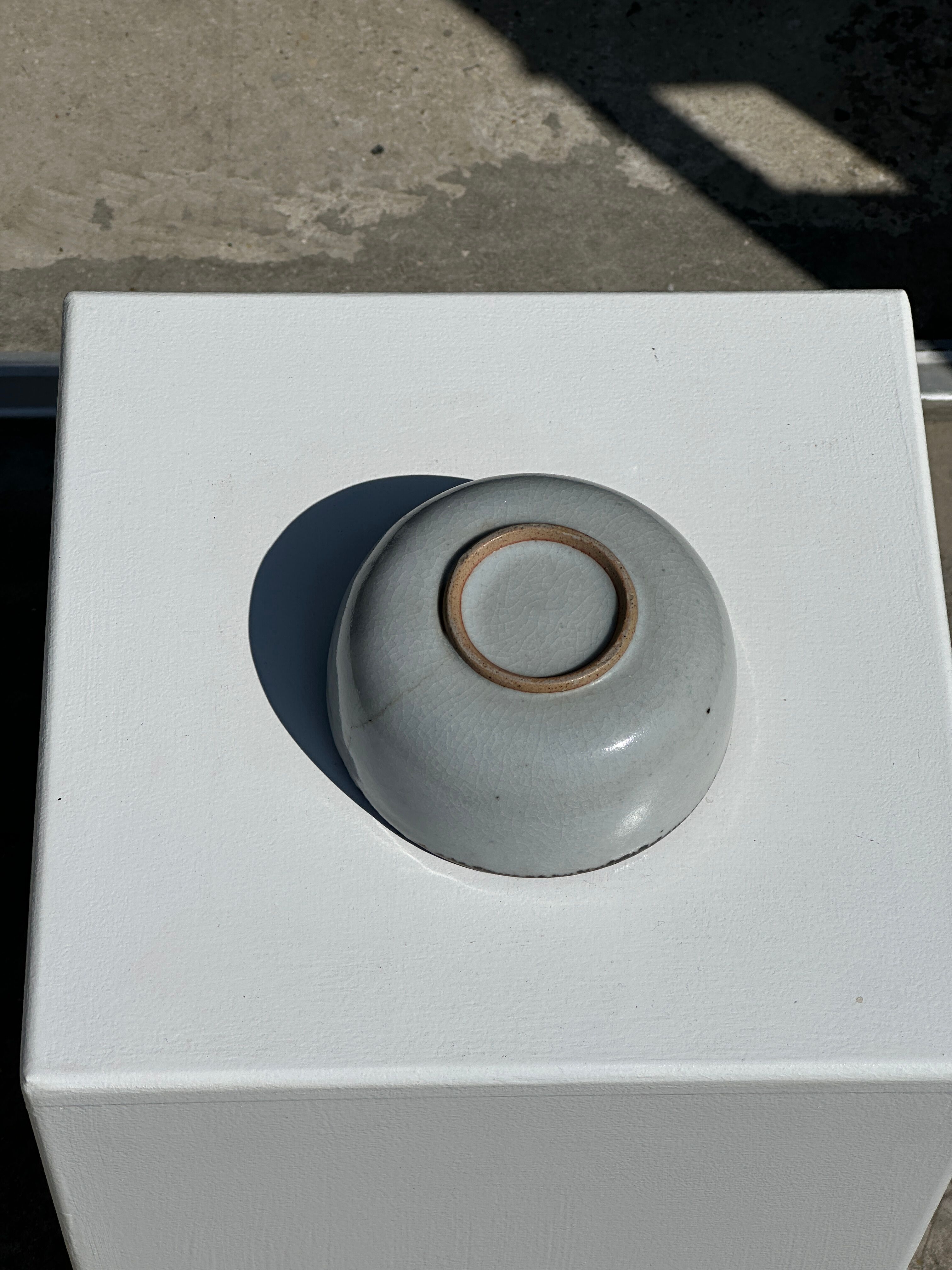 Small white glazed ceramic bowl black edges