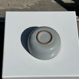 Small white glazed ceramic bowl black edges