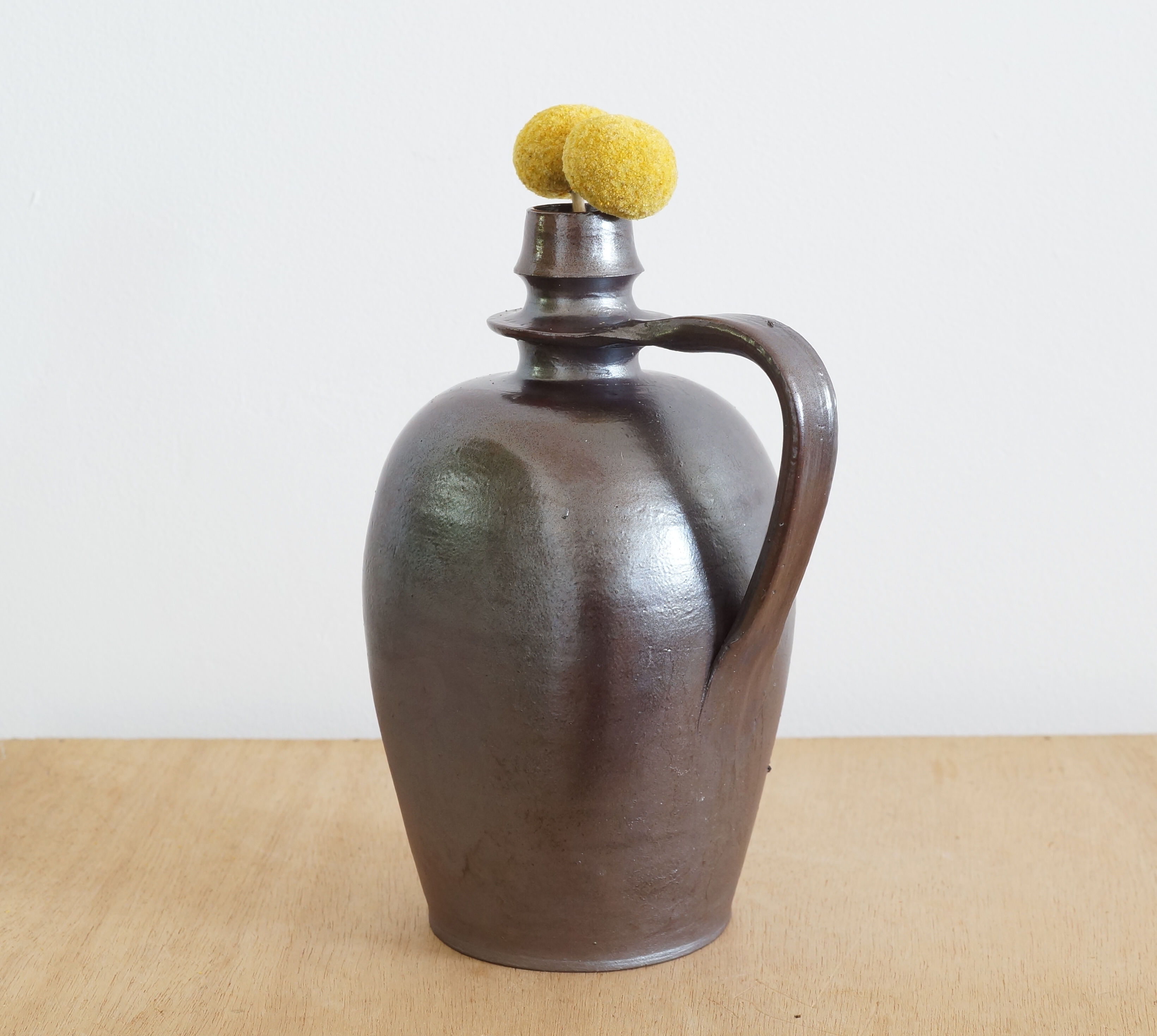 Old Norman bottle in brown ceramic