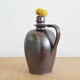 Old Norman bottle in brown ceramic
