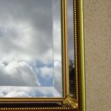 Hall mirror, gilded frame with fillets and fleur-de-lis.
