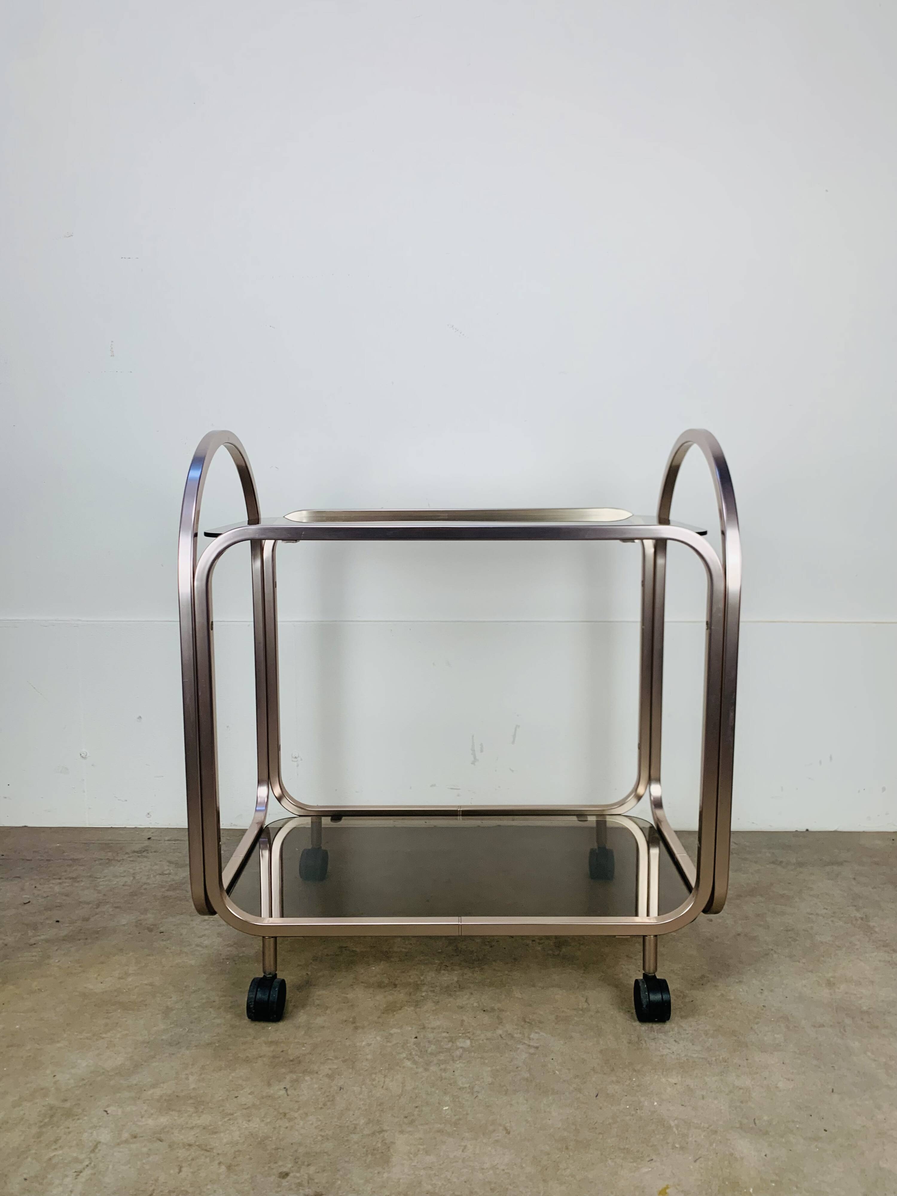 Kaymet dessert trolley in smoked glass and anodised aluminium, 1980s.