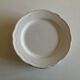 Set of 7 Mougins plates in white enamelled clay with gadroons