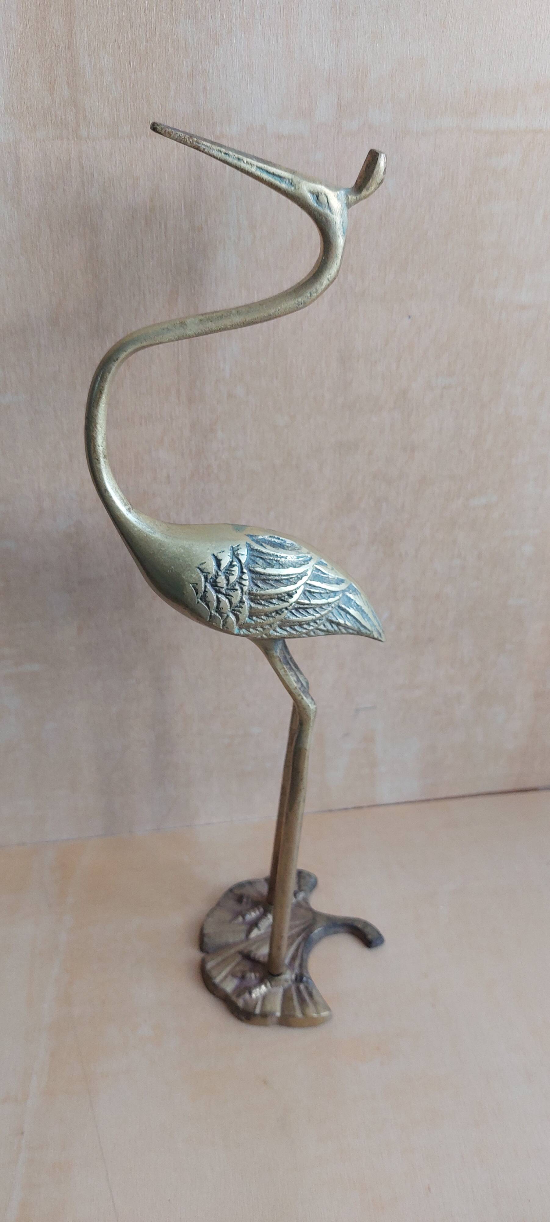 Heron bird in vintage golden brass