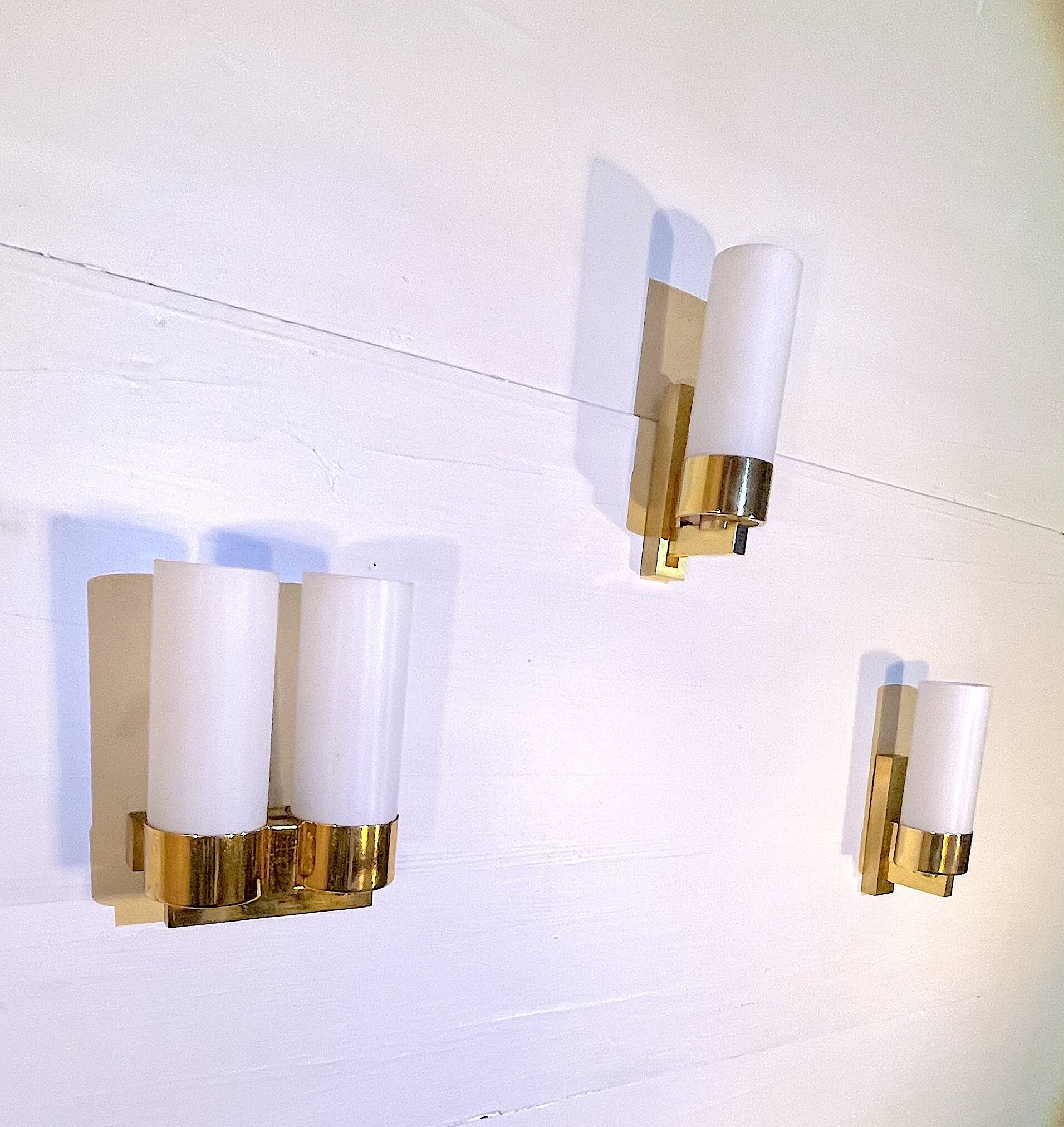 Set of three brass and opaline sconces, mid-century France