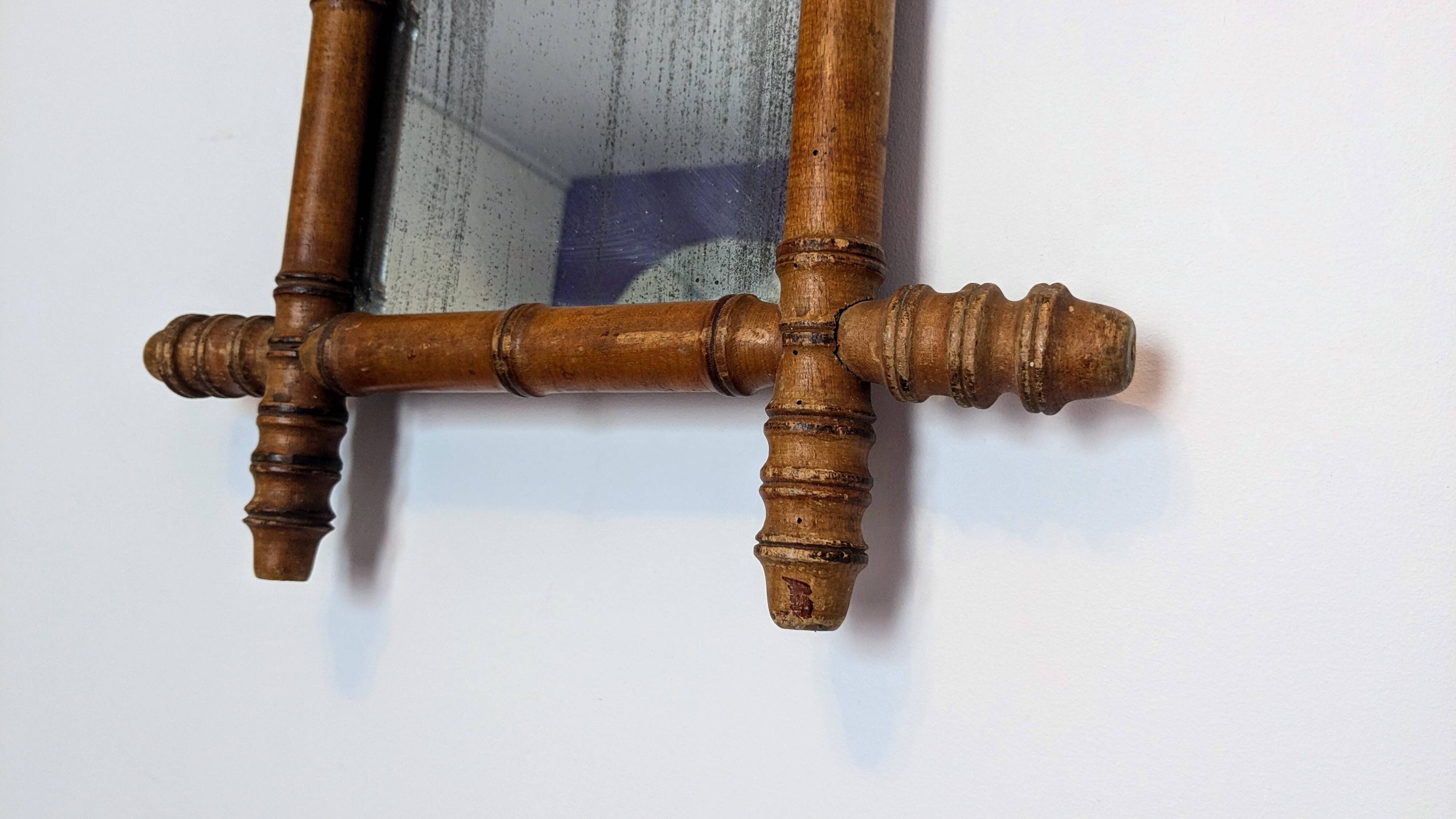 Antique bamboo mirror with pitted glass 40x34 cm