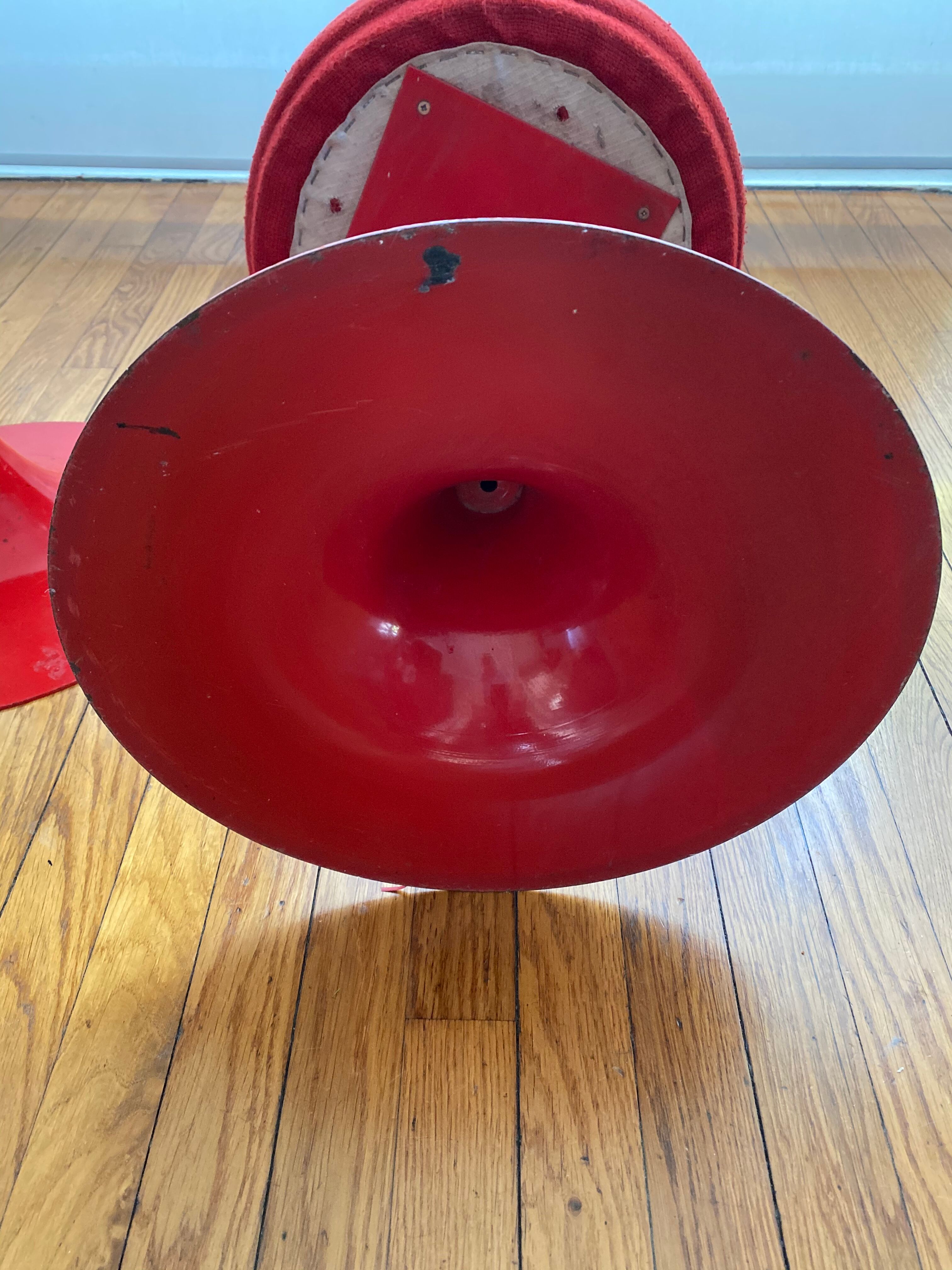 Pair of low tulip stools in red metal 1970