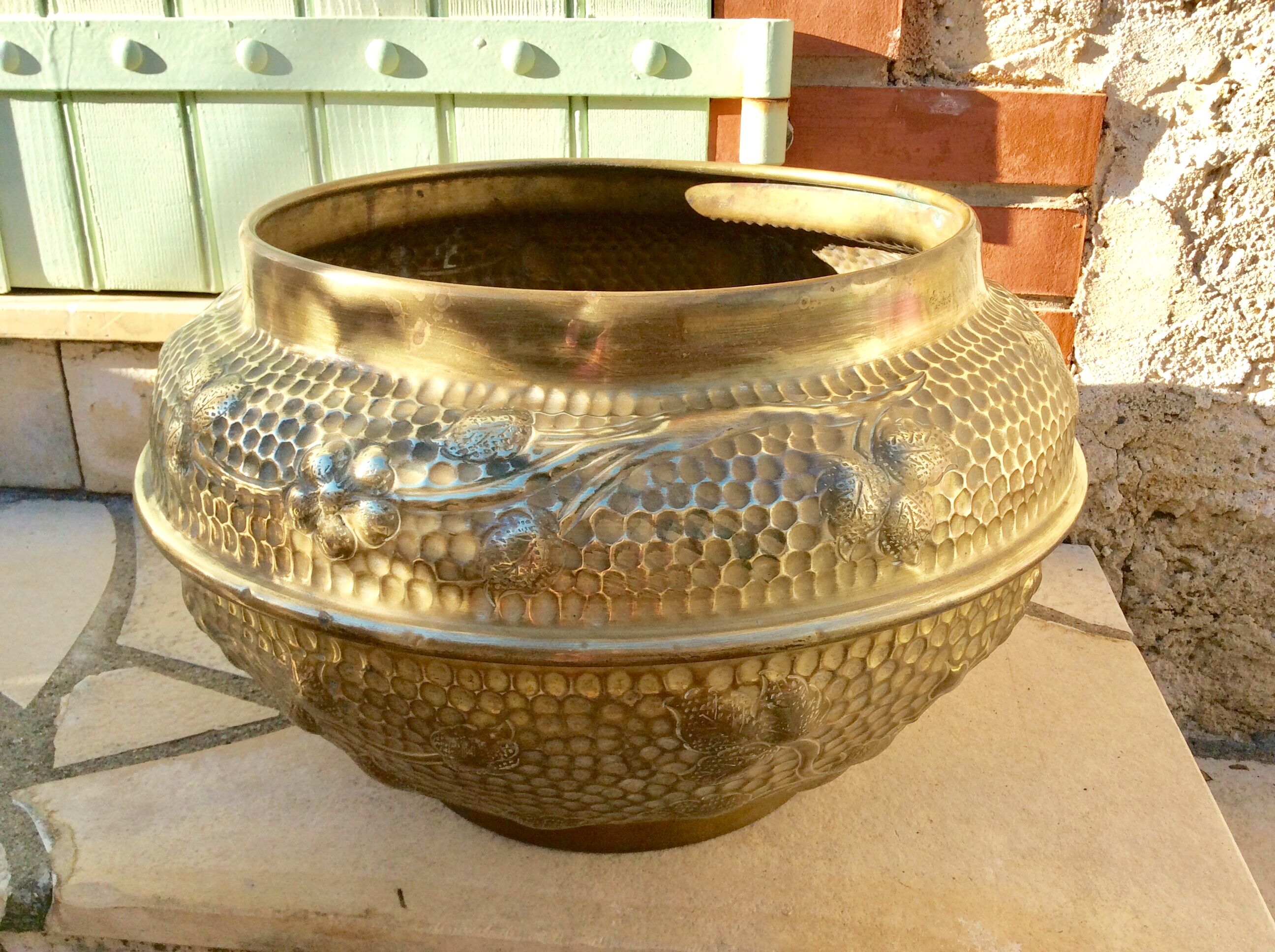 Old brass pot cover