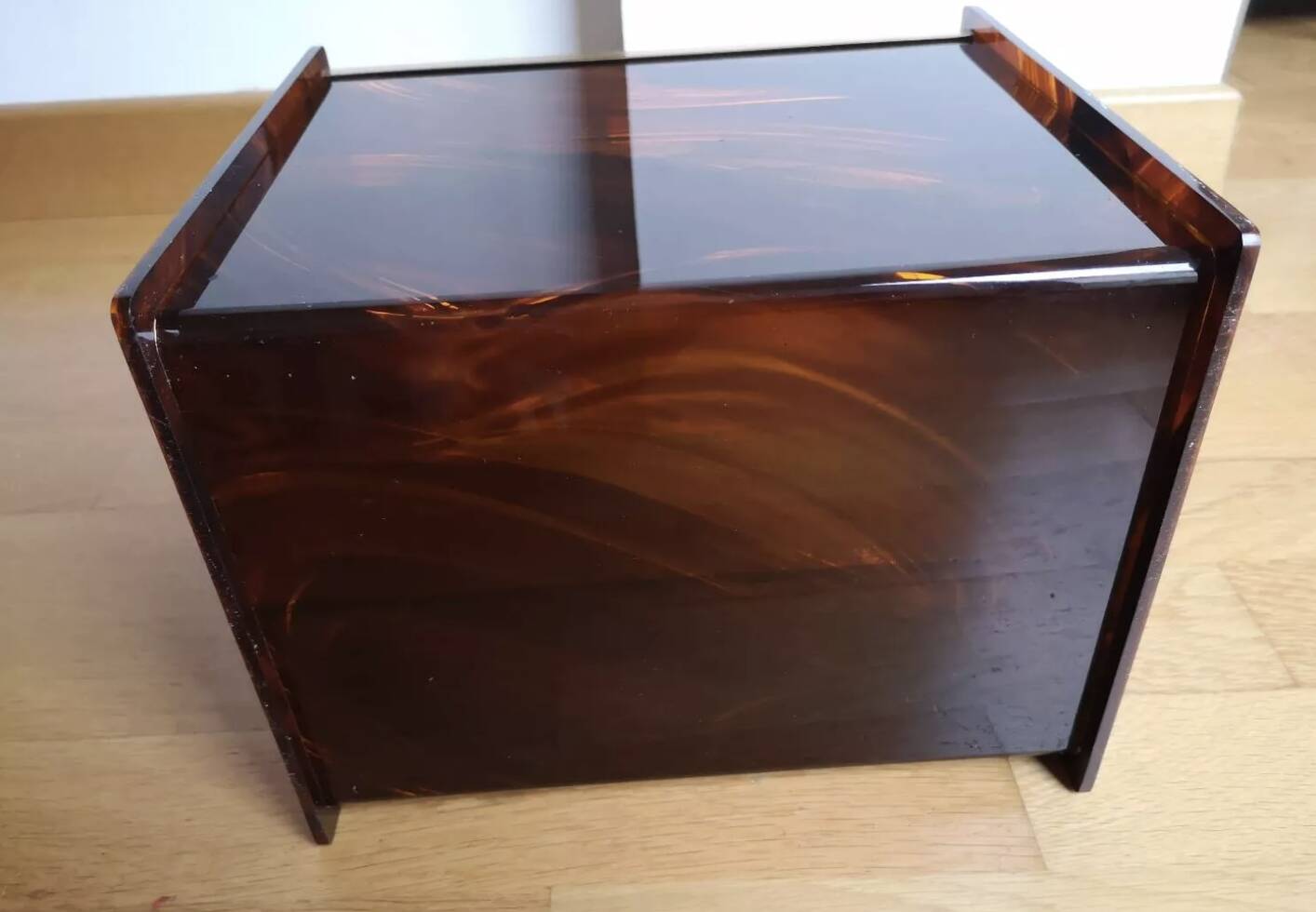 Tortoiseshell lucite magazine rack from the Christian Dior Home collection.