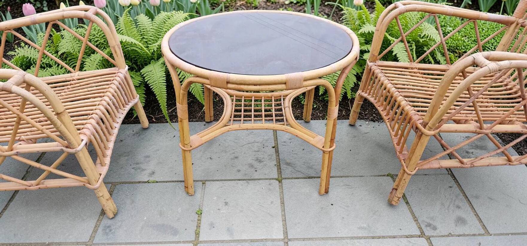 Vintage rattan garden furniture with cushions.