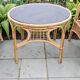Vintage rattan garden furniture with cushions.