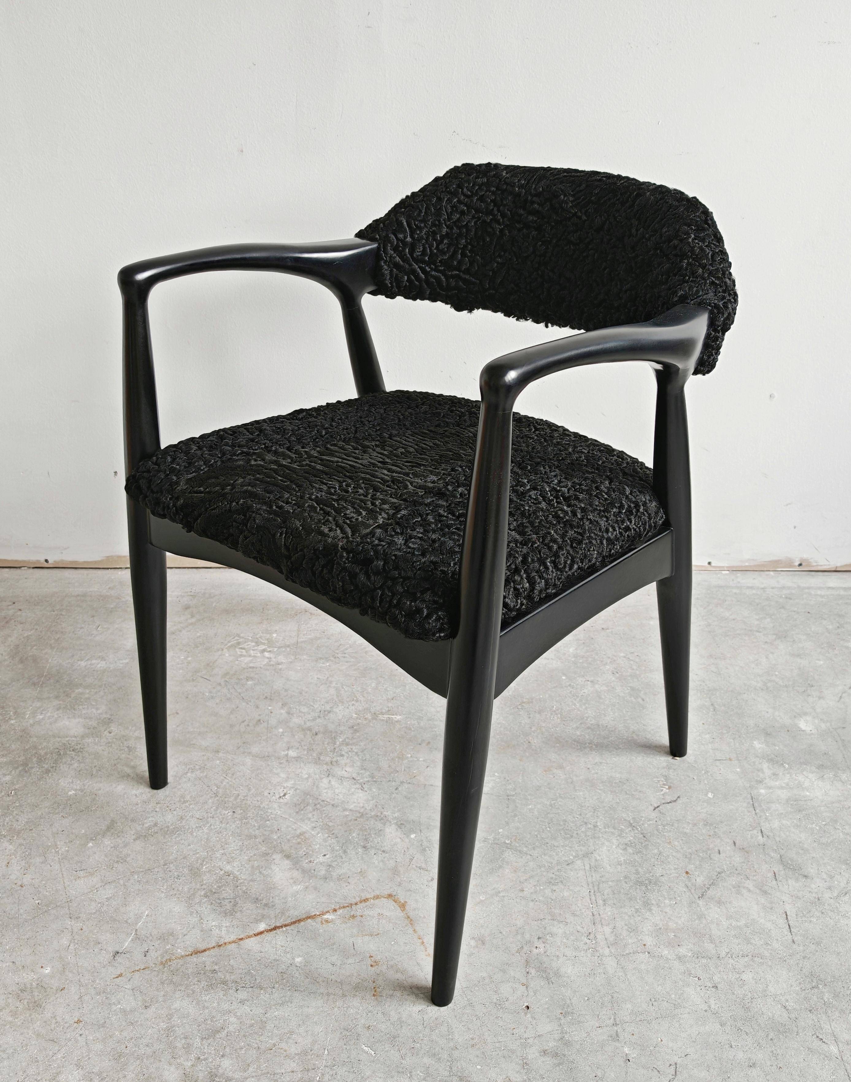 Pair of Mid Century Modern armchairs in astrakhan leather.