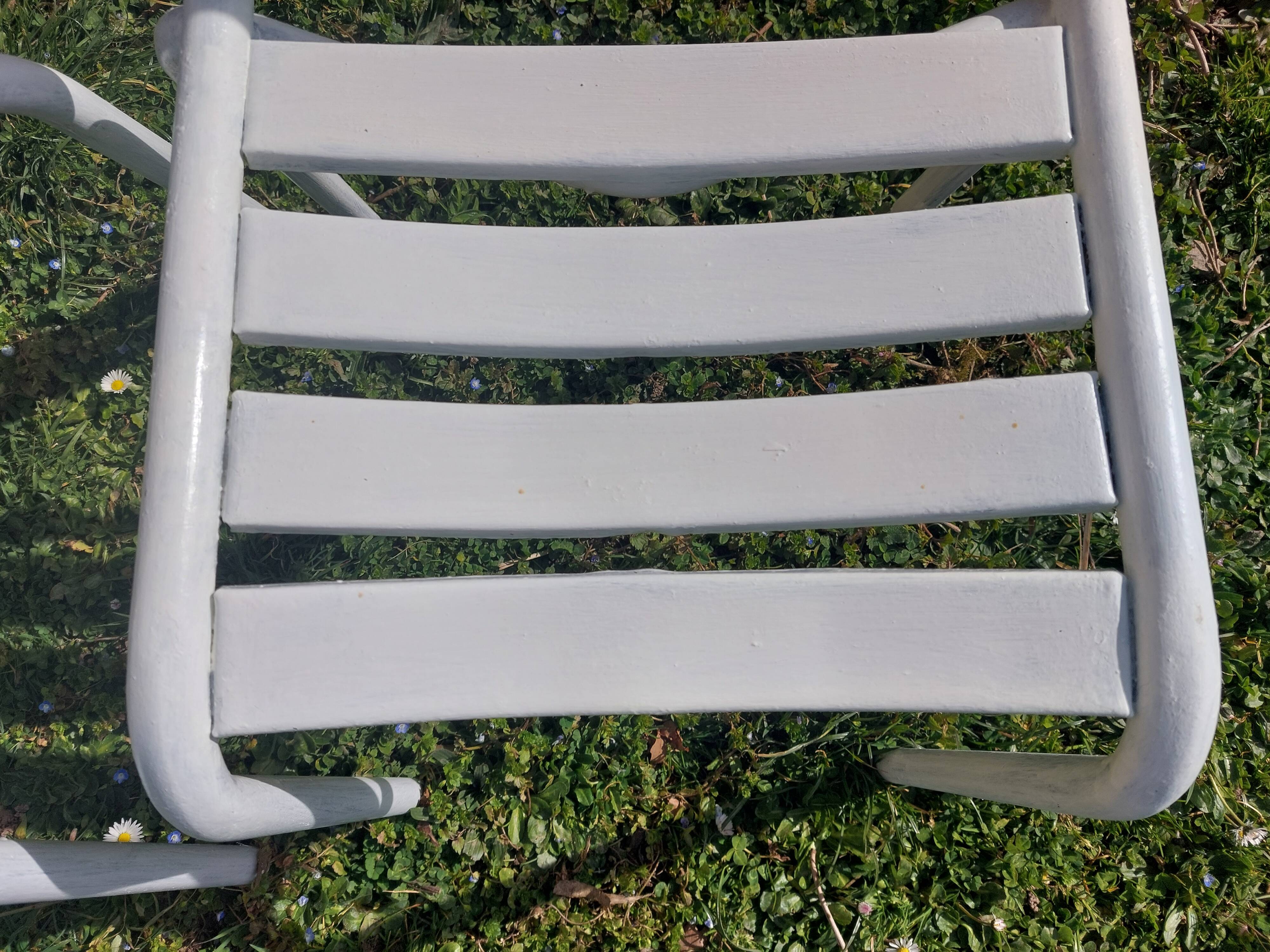 pair of white metal chairs, Tolix style