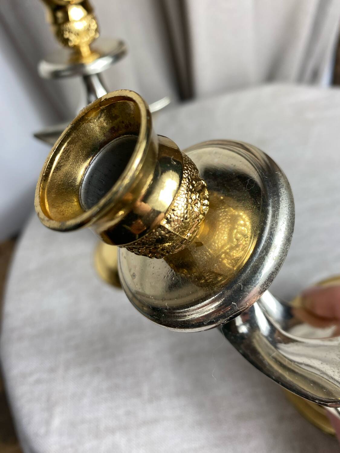 Pair of silver and gold metal candlesticks