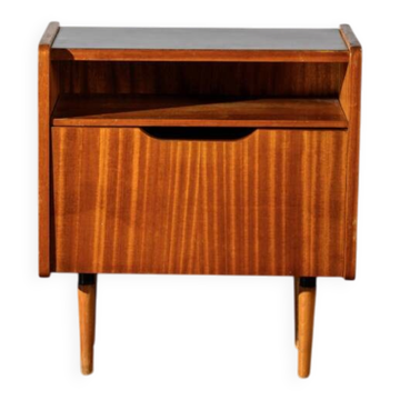 Bedside table with a drop-down door.