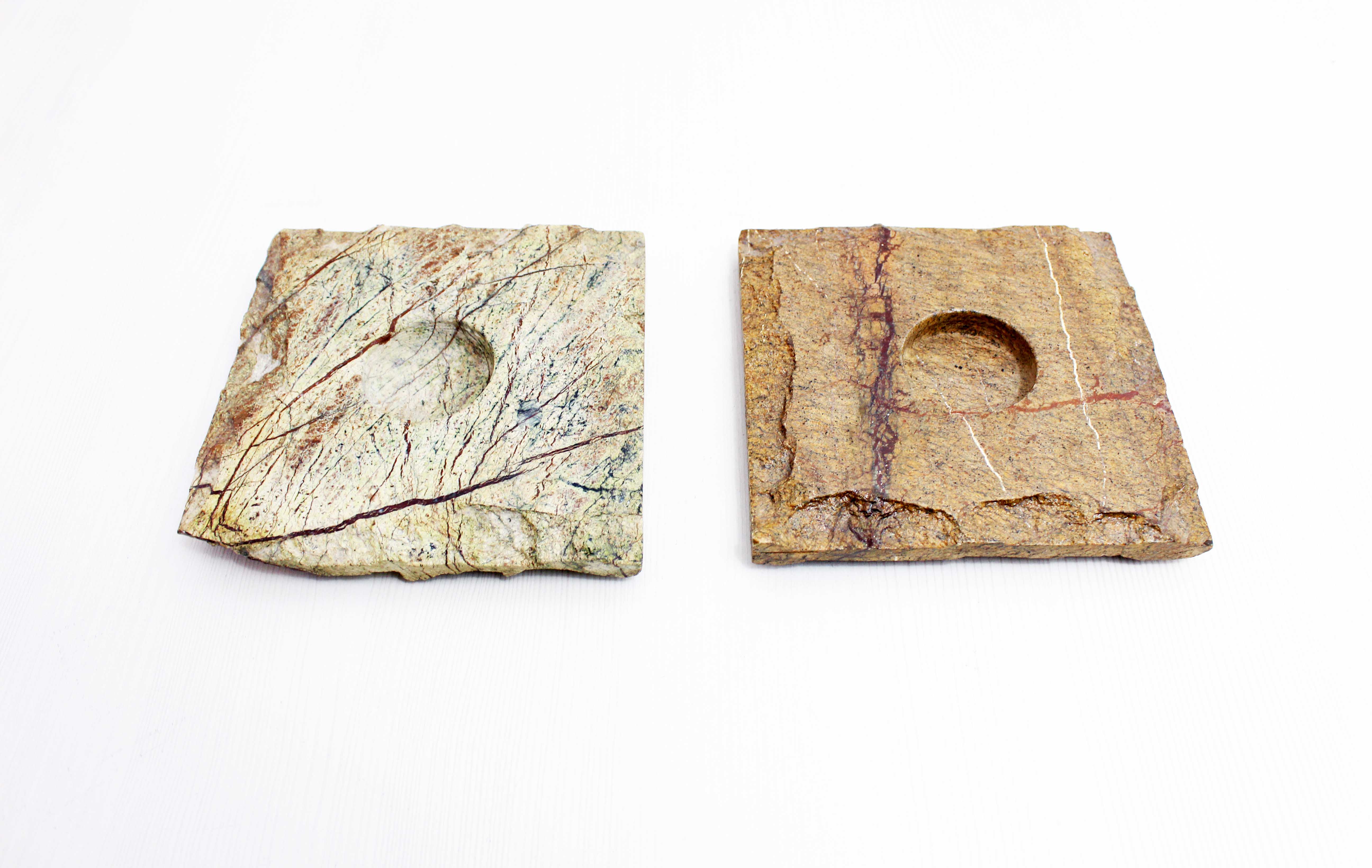 Pair of brutalist travertine candle holders