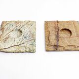 Pair of brutalist travertine candle holders