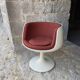 Two cognac-colored swivel chairs made of fiberglass from the 1970s