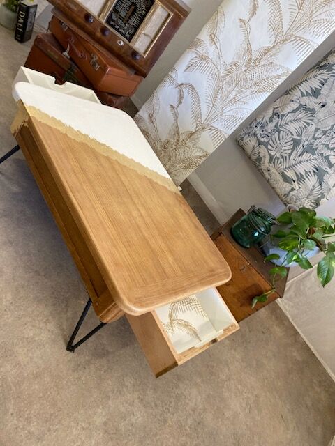 Coffee table with pin legs and gold leaf