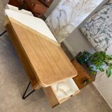 Coffee table with pin legs and gold leaf