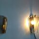 Pair of brass and curved glass wall lamps from the 80s