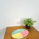 Pastel color bowls set in rattan basket vintage