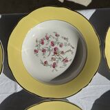 Set of 9 large vintage yellow deep plates with pink flowers and a gold rim.