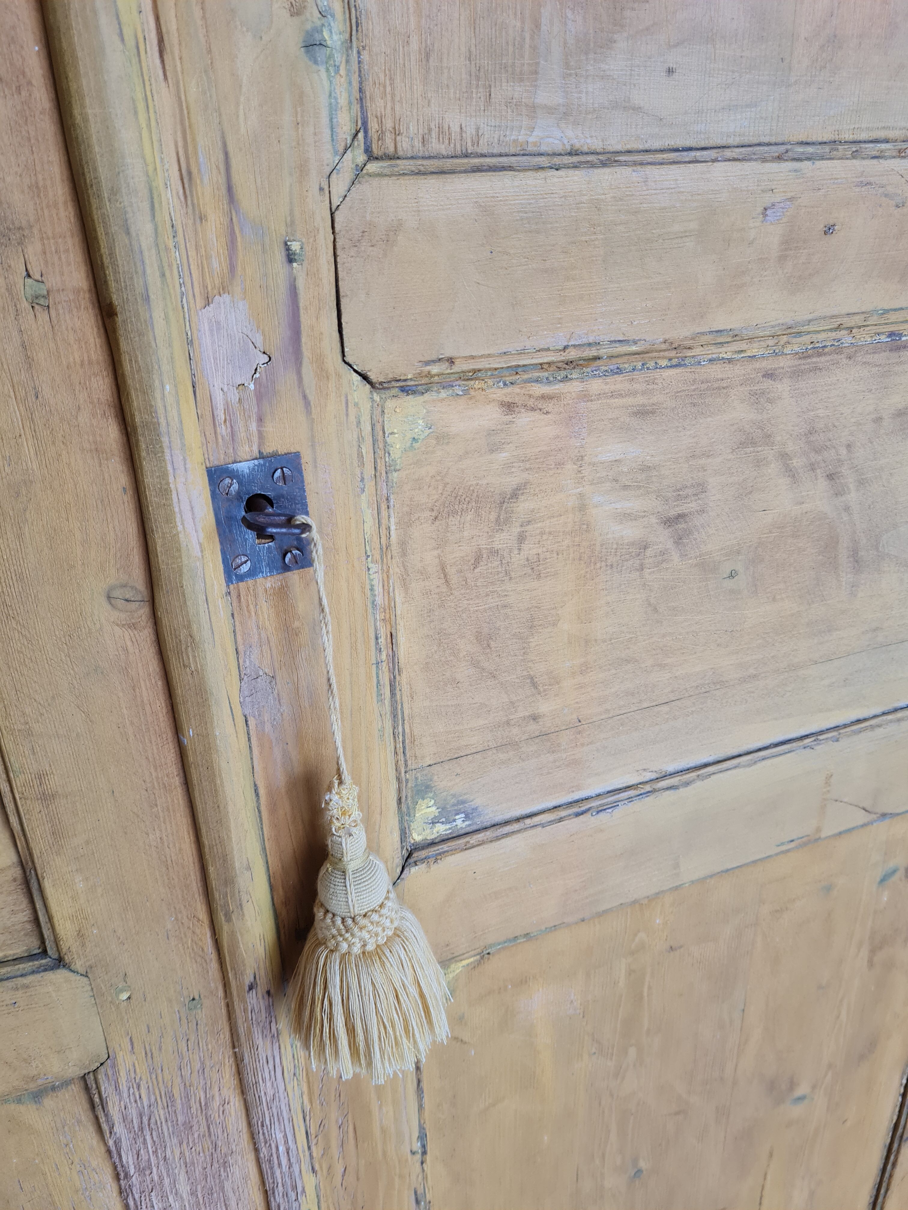 Mustard yellow patinated cabinet