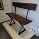 Old garden bench with iron legs and wooden seats