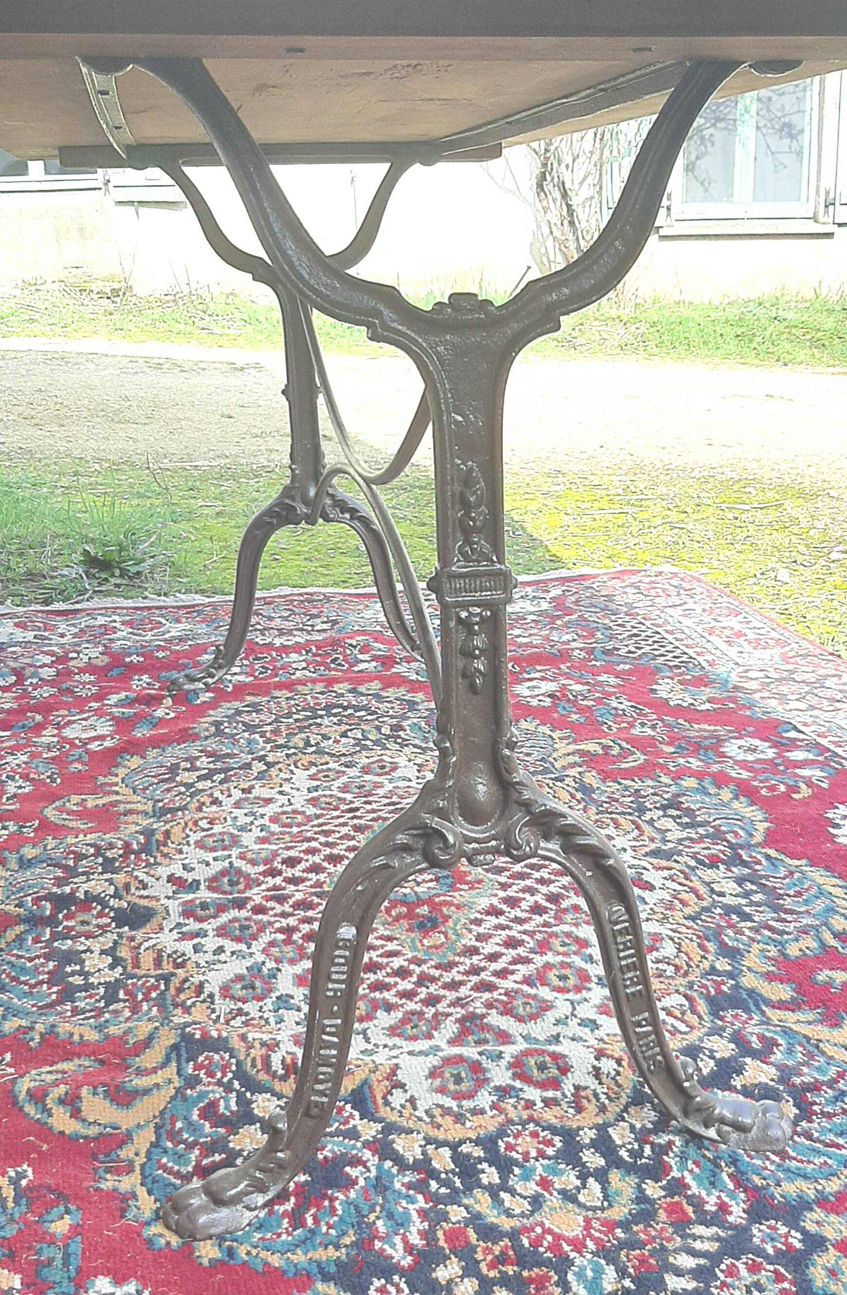 Large bistro table with cast iron legs and cherry top