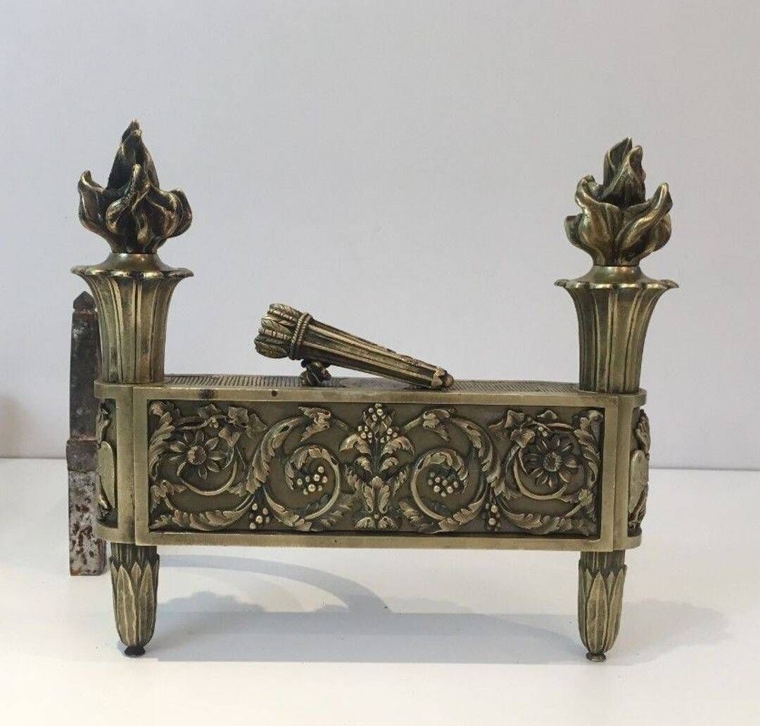 Pair of Empire Period Chenets in Chiselled Bronze with Torches and Leaf Frieze