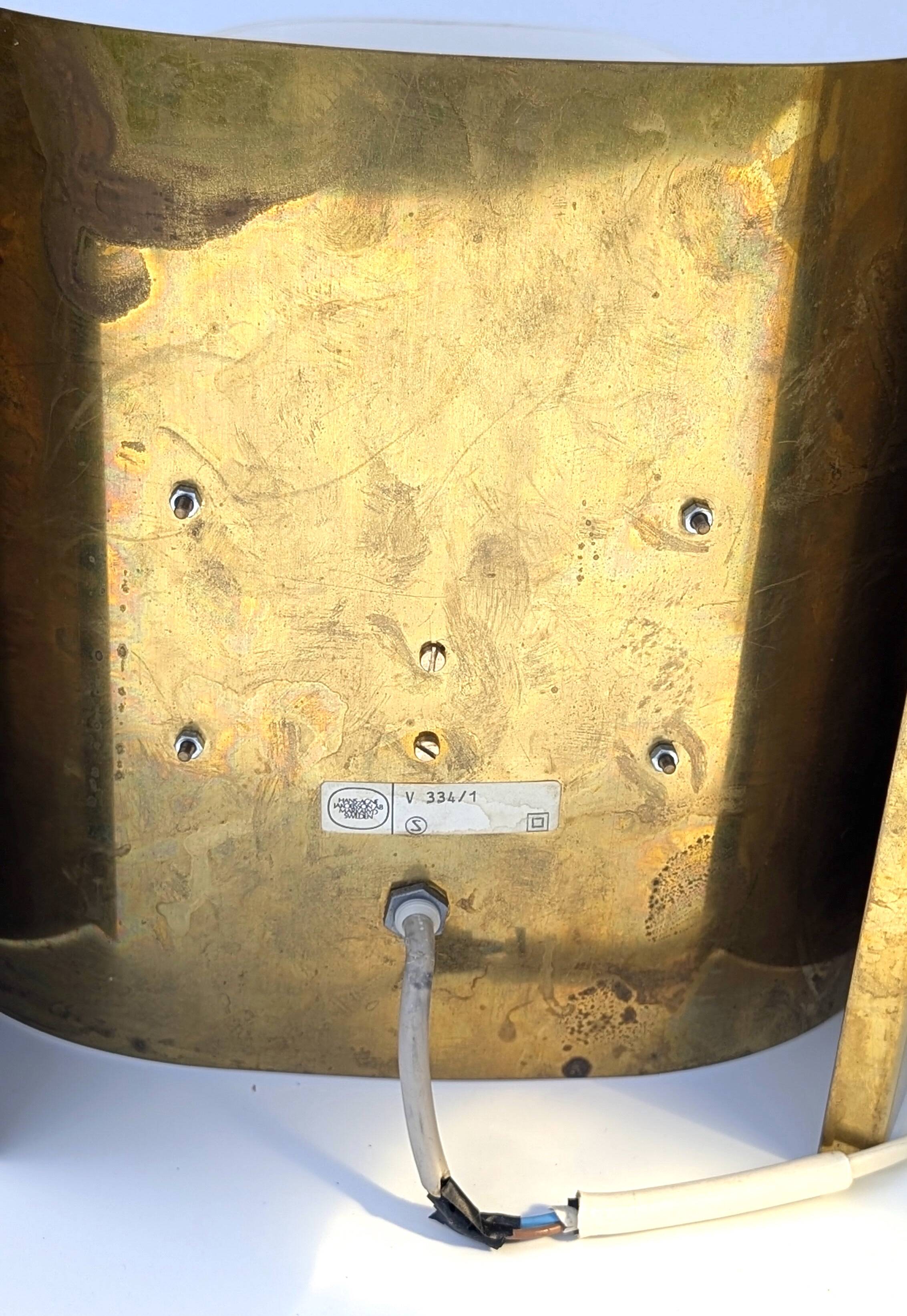 Pair of Hans-Agne Jakobsson V334/1 wall lamps in brass and opaline plastic