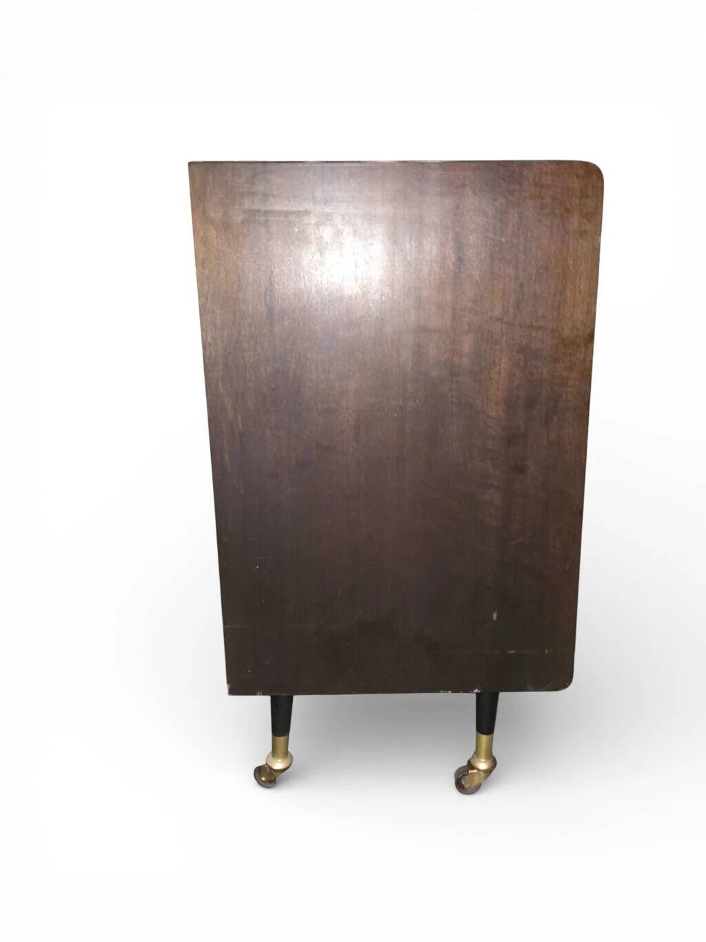 Vintage 50s-60s bar cabinet with tufted upholstery and lighting.
