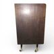 Vintage 50s-60s bar cabinet with tufted upholstery and lighting.