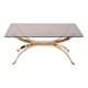 Gold Colored Mid-Century Modern coffee table with smoked Glass top