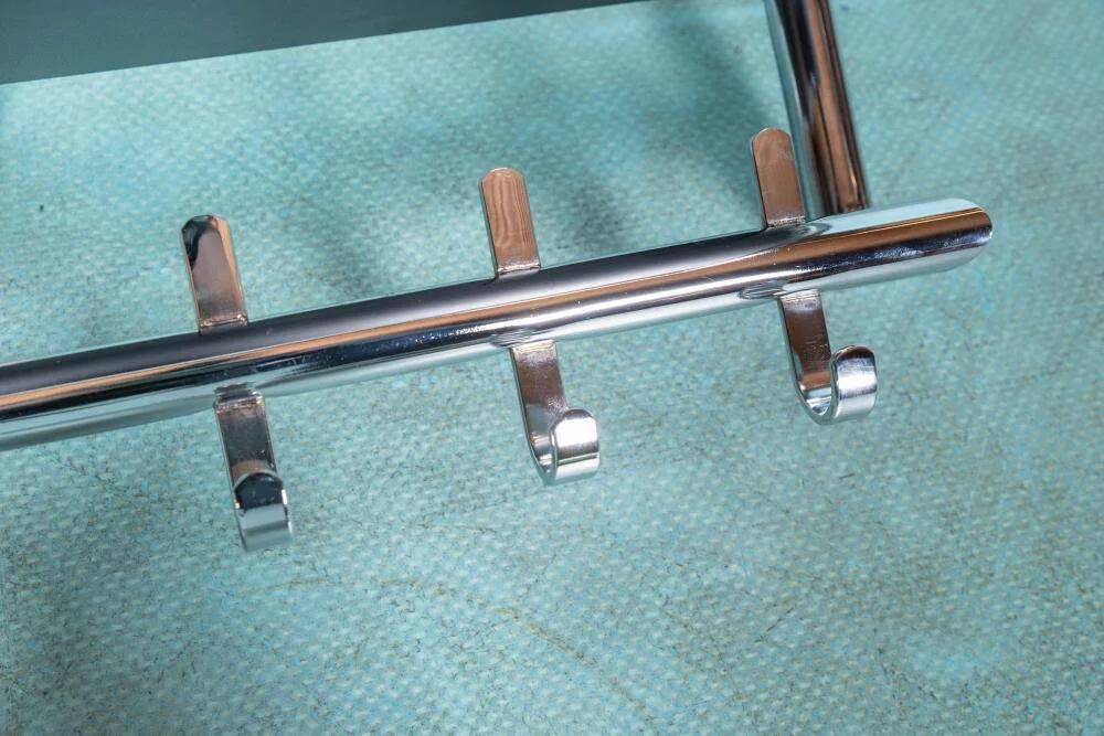 Minimalist coat rack, tubular chrome frame, 1980s Memphis style.