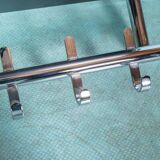 Minimalist coat rack, tubular chrome frame, 1980s Memphis style.