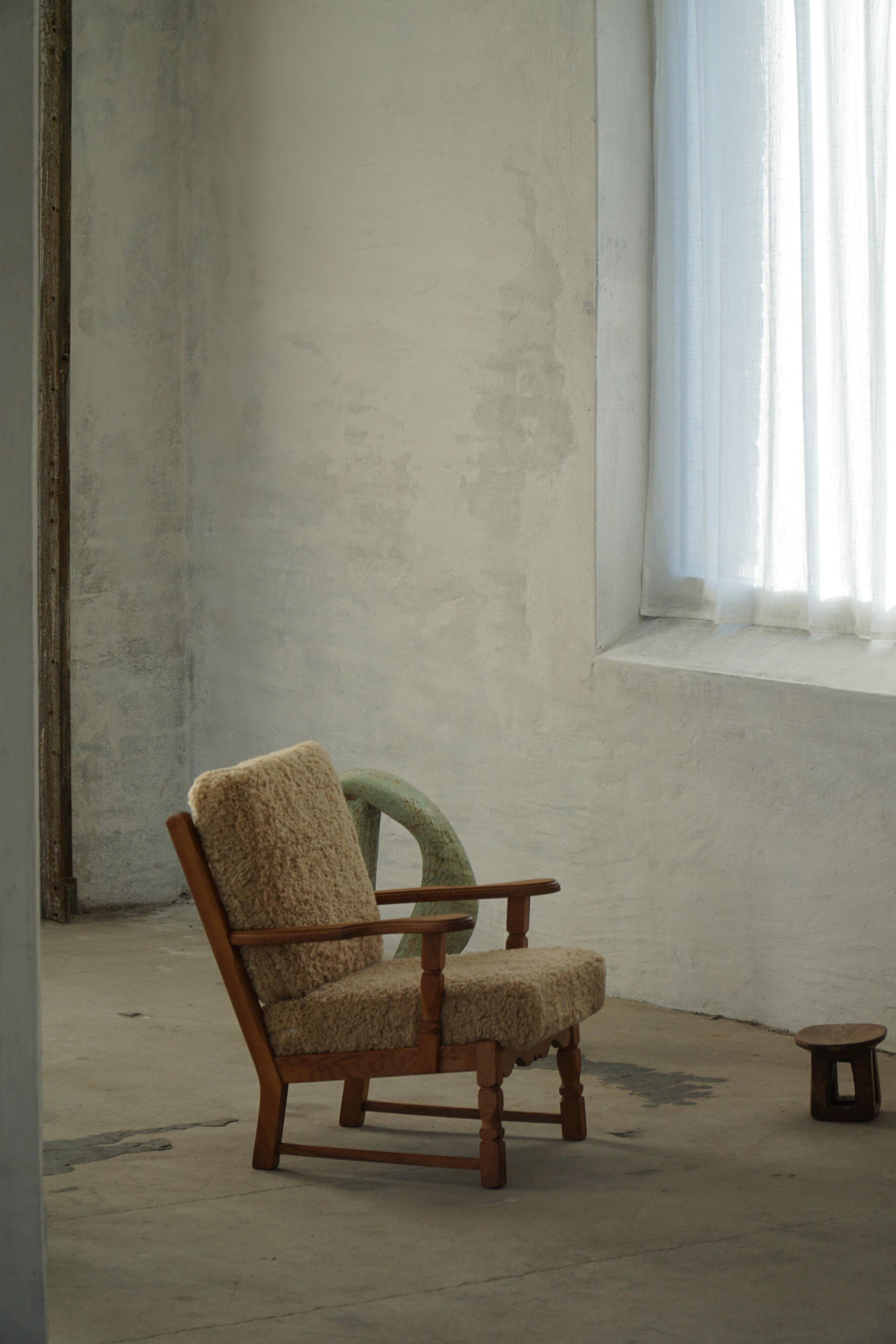 Danish modernist lounge chair in oak and lambswool, Henning Kjærnulf, 1960s