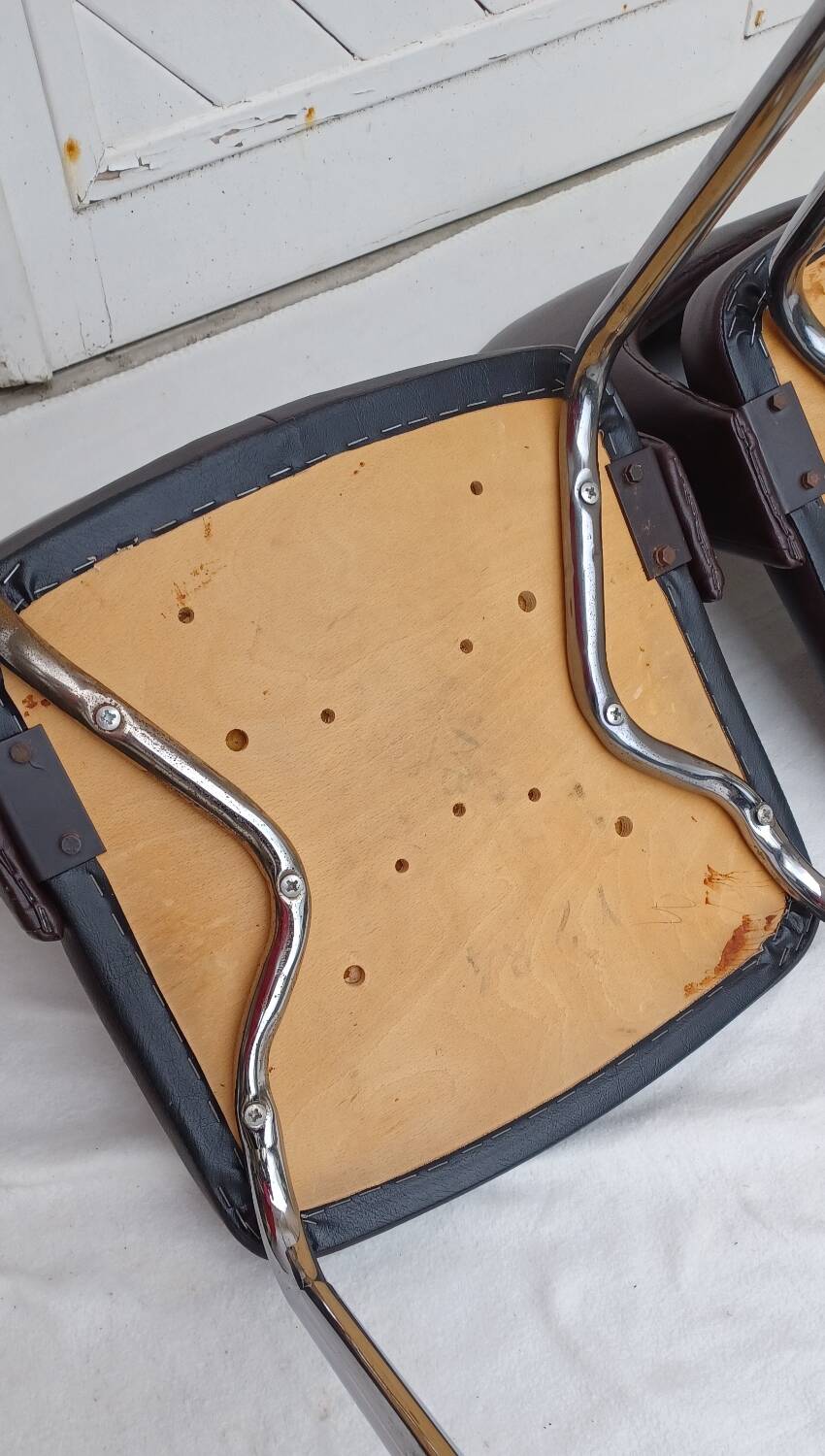 Pair of vintage faux leather and chrome armchairs